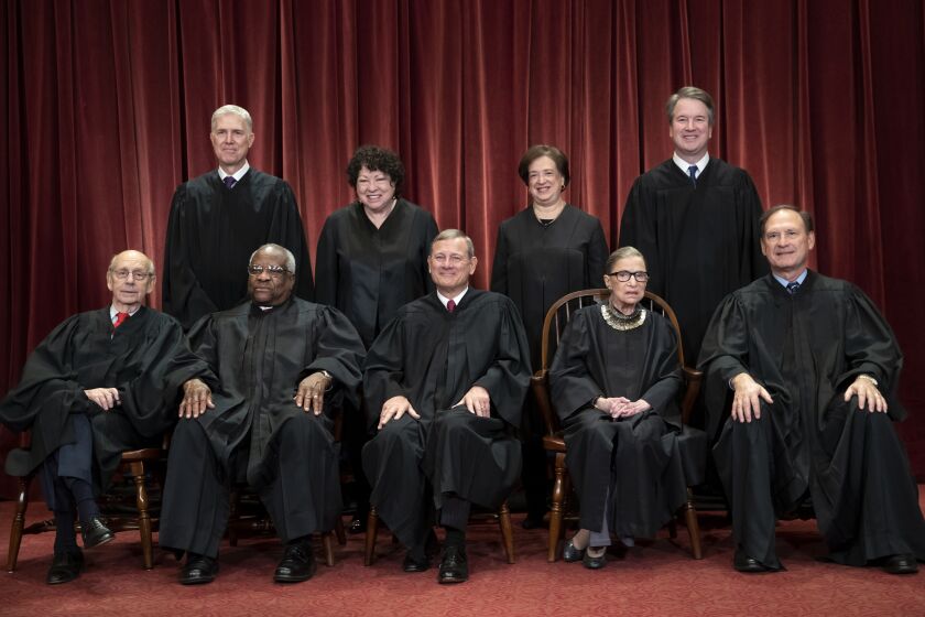 FILE - In this Nov. 30, 2018, file photo, the justices of the U.S. Supreme Court gather for a formal group portrait to include the new Associate Justice, top row, far right, at the Supreme Court building in Washington. Seated from left: Associate Justice Stephen Breyer, Associate Justice Clarence Thomas, Chief Justice of the United States John G. Roberts, Associate Justice Ruth Bader Ginsburg and Associate Justice Samuel Alito Jr. Standing behind from left: Associate Justice Neil Gorsuch, Associate Justice Sonia Sotomayor, Associate Justice Elena Kagan and Associate Justice Brett M. Kavanaugh. It’s the time of the year when Supreme Court justices can get testy, but they might have to find a new way to show it. (AP Photo/J. Scott Applewhite, File)