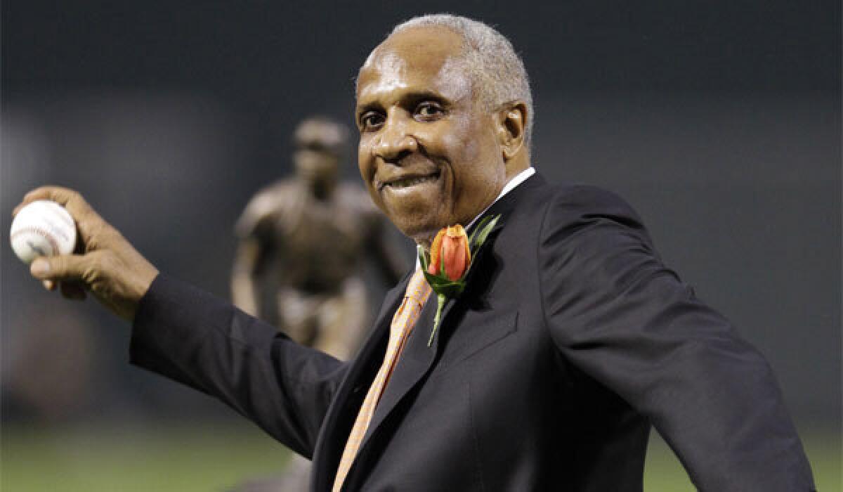 Former Orioles outfielder Frank Robinson throws out the ceremonial first pitch before a game in Baltimore in April 2012.