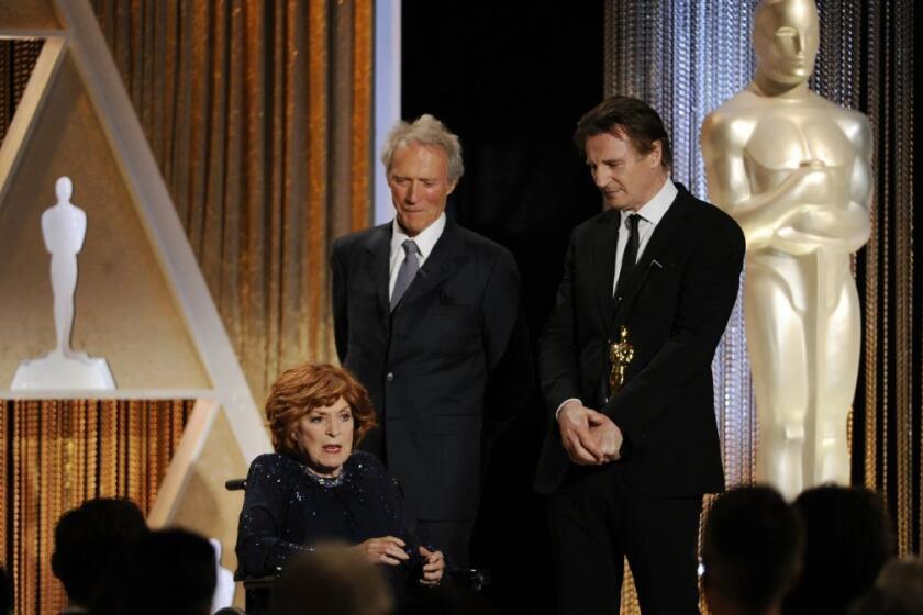 Maureen O'Hara accepts her honorary Oscar from Clint Eastwood and Liam Neeson at the 2014 Governors Awards.