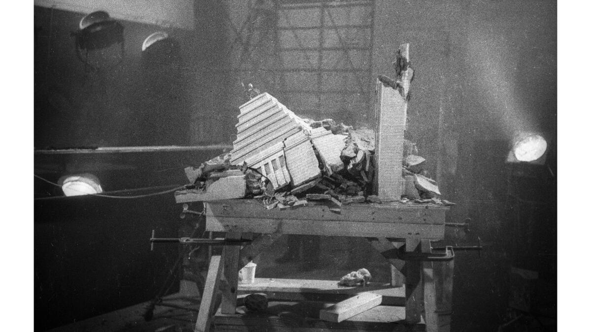 May 8, 1952: The remains of a model of Los Angeles City Hall rest on a table after the explosion.