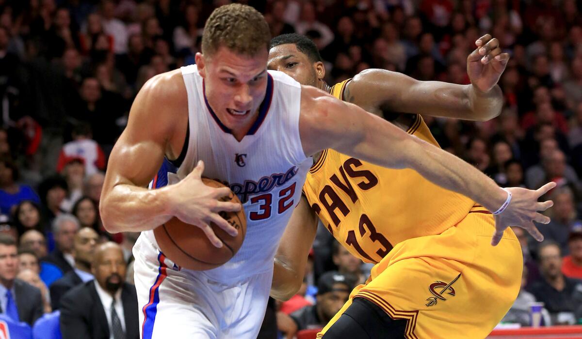 Clippers forward Blake Griffin drives past Cavaliers forward Tristan Thompson, who was called for a foul on the play in the first half.