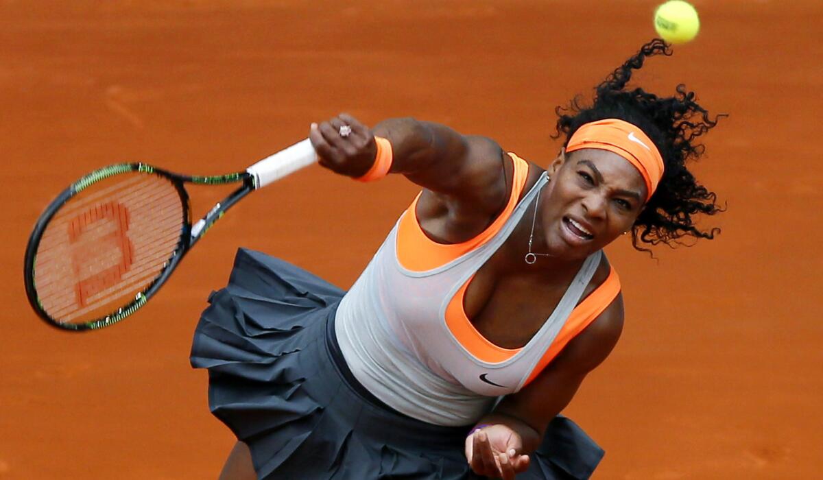 Serena Williams hits an overhead shot during her match against Madison Brengle on Sunday in Madrid.