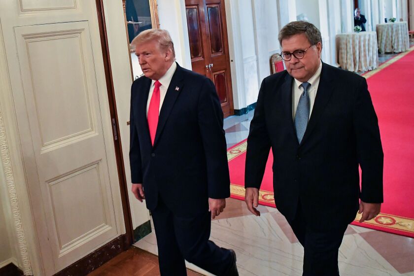 (FILES) In this file photo taken on September 09, 2019 US President Donald Trump (L) and Attorney General William Barr arrive to present the Medal of Valor and Heroic Commendations to officers and civilians who responded to mass shootings in Dayton, Ohio and El Paso, Texas, in the East Room of the White House in Washington, DC. - President Donald Trump dismissed rare criticism from his attorney general February 14, 2020, tweeting that he has the "legal right" to intervene in criminal cases whenever he likes. The Republican businessman has been accused by opponents in Congress of trying to strip away the Justice Department's independence to benefit himself and his allies. (Photo by NICHOLAS KAMM / AFP) (Photo by NICHOLAS KAMM/AFP via Getty Images) ** OUTS - ELSENT, FPG, CM - OUTS * NM, PH, VA if sourced by CT, LA or MoD **