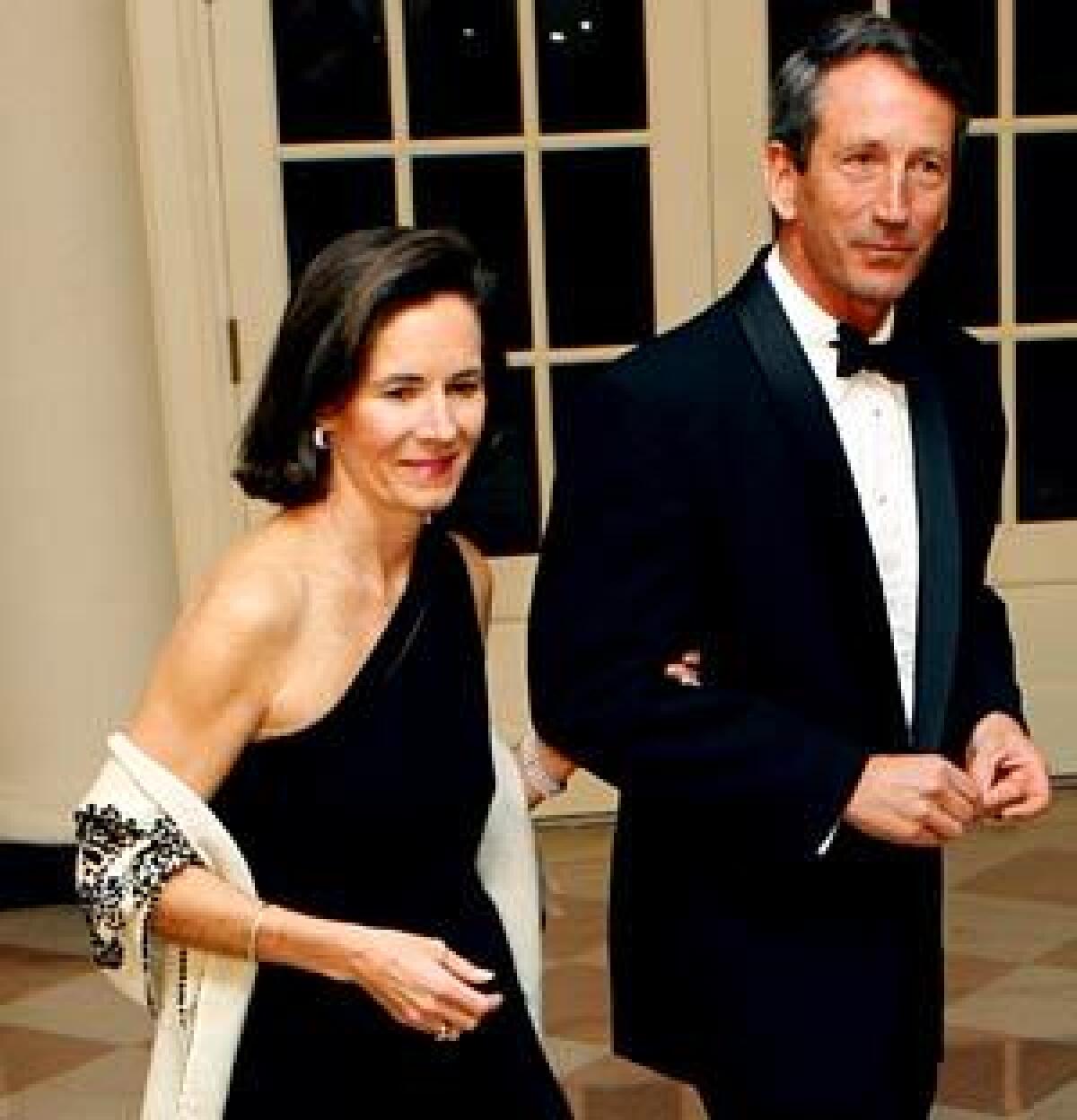 Jenny and Mark Sanford attend a White House dinner hosted by President Obama. Jenny Sanford's memoir, "Staying True," details a difficult marriage.