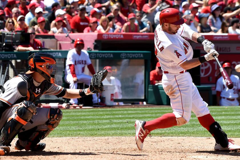 Angels' Johnny Giavotella hits an RBI single in the seventh inning against the Baltimore Orioles at Angel Stadium on Sunday.