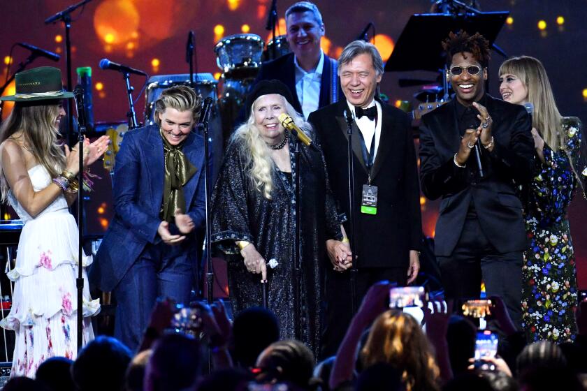 US singer Lauren Daigle, Brandi Carlile, Joni Mitchell, Jon Batiste and Yola perform on stage during the 2022 MusiCares Person of the Year gala honoring Joni Mitchell at the MGM Grand Conference Center in Las Vegas, Nevada, April 1, 2022. (Photo by ANGELA WEISS / AFP) (Photo by ANGELA WEISS/AFP via Getty Images)