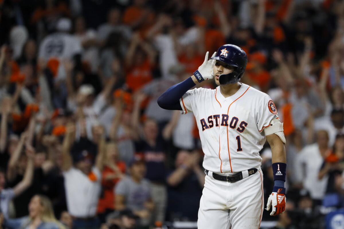 Houston Astros shortstop Carlos Correa celebrates after his walk-off home run against the New York Yankees during the 11th inning in Game 2 of baseball's American League Championship Series Monday, Oct. 14, 2019, in Houston. (AP Photo/Matt Slocum)