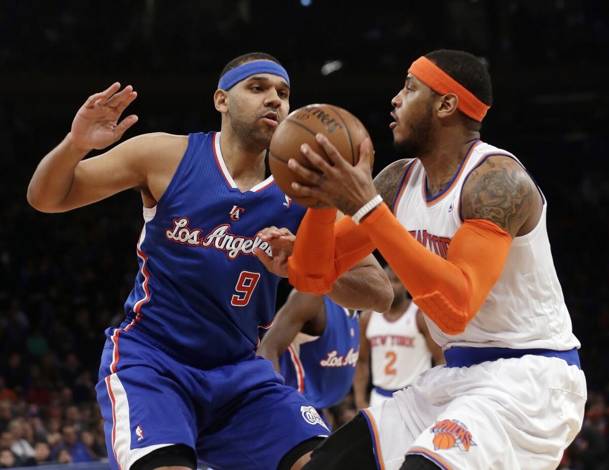 Jared Dudley guards New York's Carmelo Anthony during the first half of the Clippers' matchup with the Knicks on Friday at Madison Square Garden.