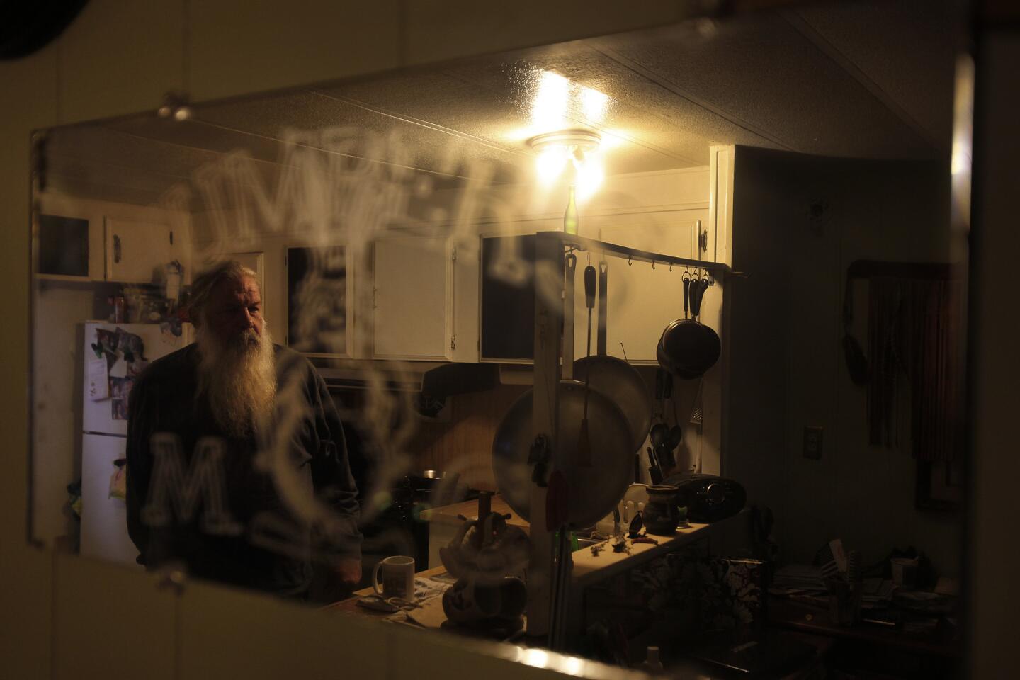 Mark Tyree Sr. stands inside the mobile home where he lives. Pictures of his son adorn the walls. His son Mark, a Marine veteran, died in 2011, from a single-car crash into a power pole after returning from Iraq. "He was so reckless at times," the veteran's father said. "He had no fear whatsoever."