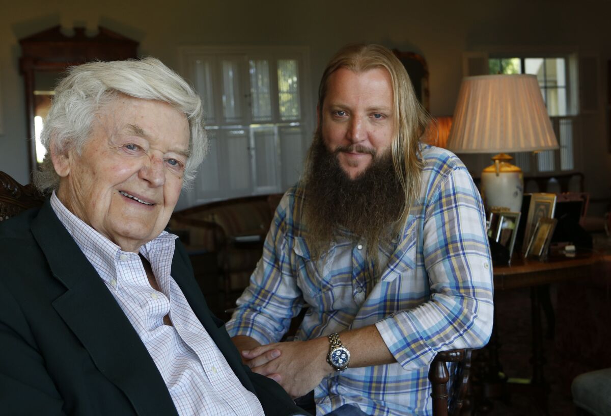 Hal Holbrook, left, and director Scott Teems, right, pose for a portrait at Holbrook's home in Beverly Hills. They teamed up for the documentary "Holbrook/Twain: An American Odyssey," a look at Holbrook's 60 year journey playing Mark Twain in his award winning show.