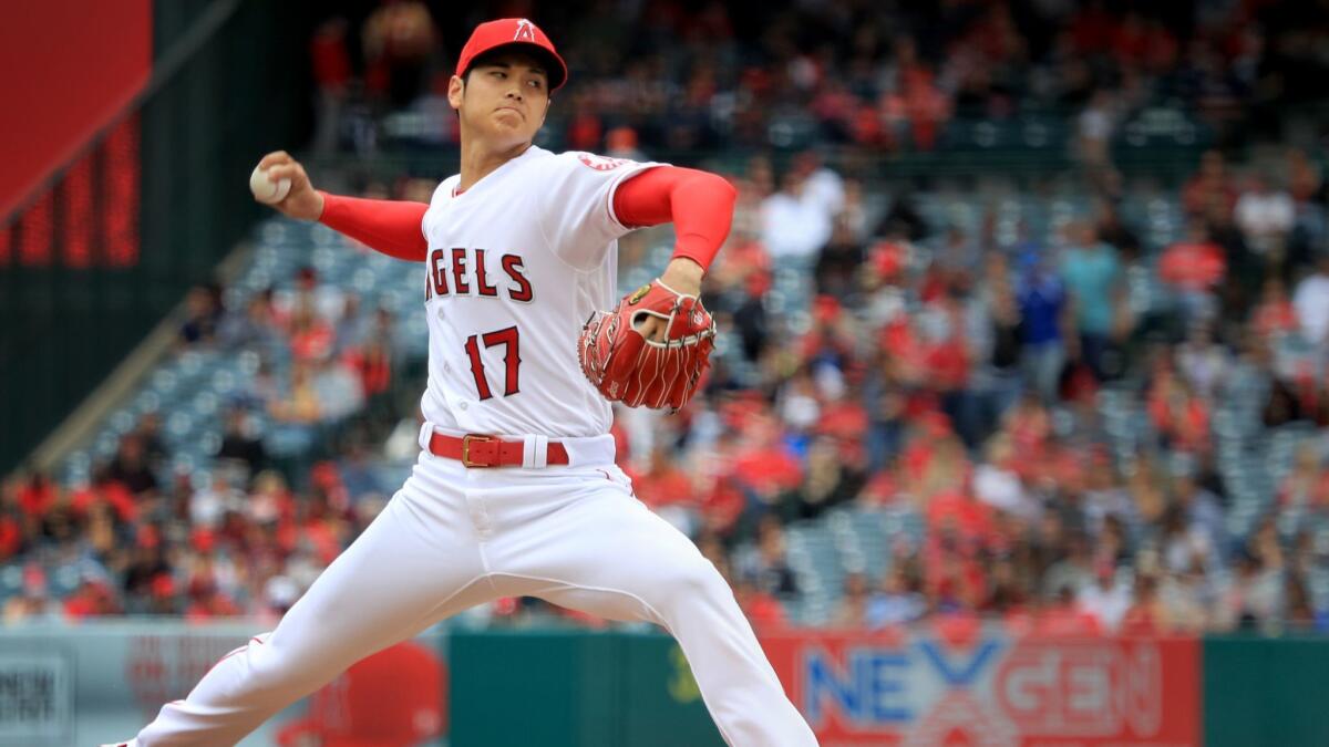 Angels starting pitcher Shohei Ohtani delivers a pitch in the first inning against the Tampa Bay Rays at Angel Stadium.