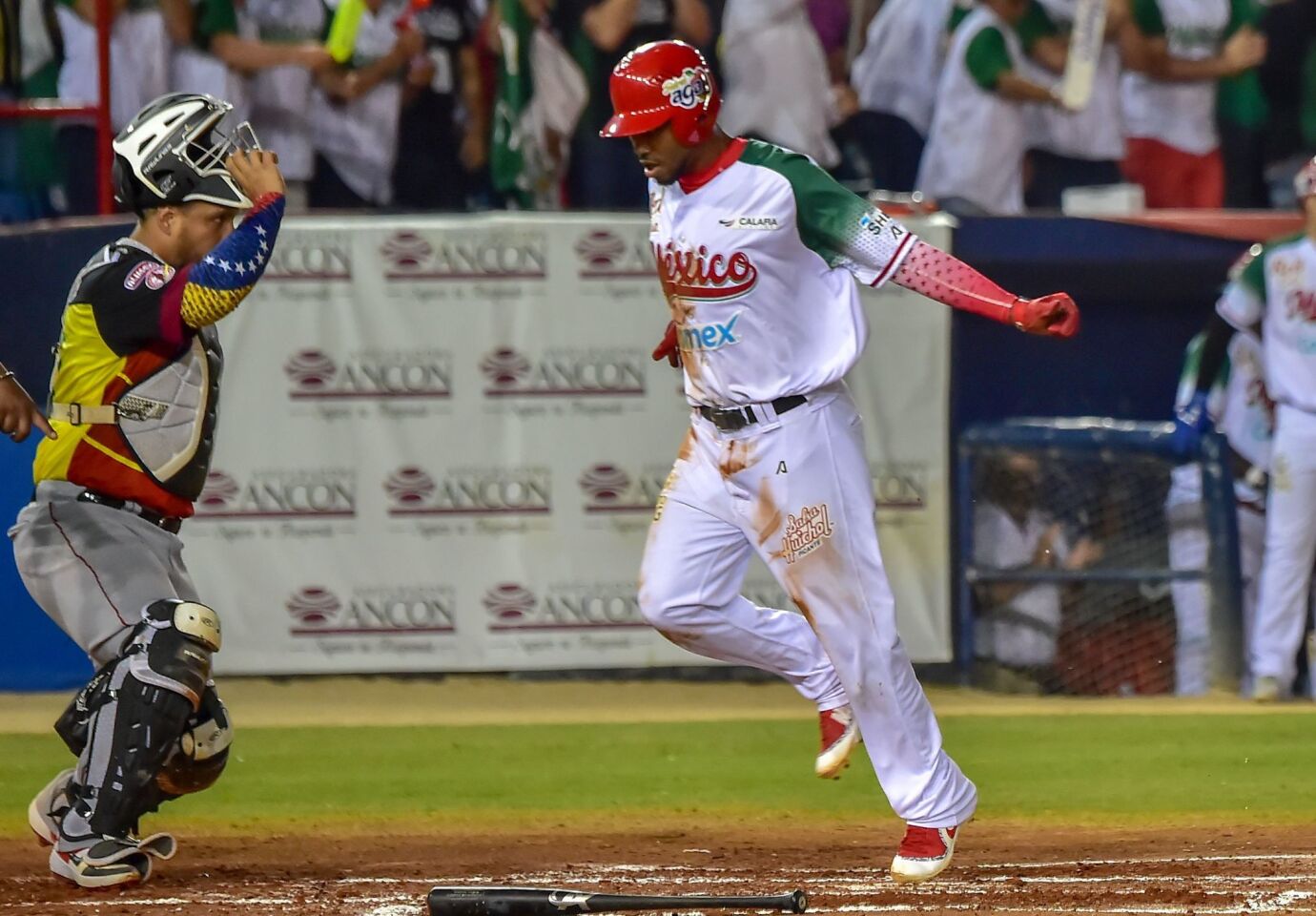Alonzo Harris (R) of Mexico's Charros de Jalisco scores a run against Juan Apodaca of Venezuela's Cardenales de Lara during the Caribbean Series baseball tournament at Rod Carew stadium in Panama City on February 8, 2019. (Photo by Luis ACOSTA / AFP)LUIS ACOSTA/AFP/Getty Images ** OUTS - ELSENT, FPG, CM - OUTS * NM, PH, VA if sourced by CT, LA or MoD **
