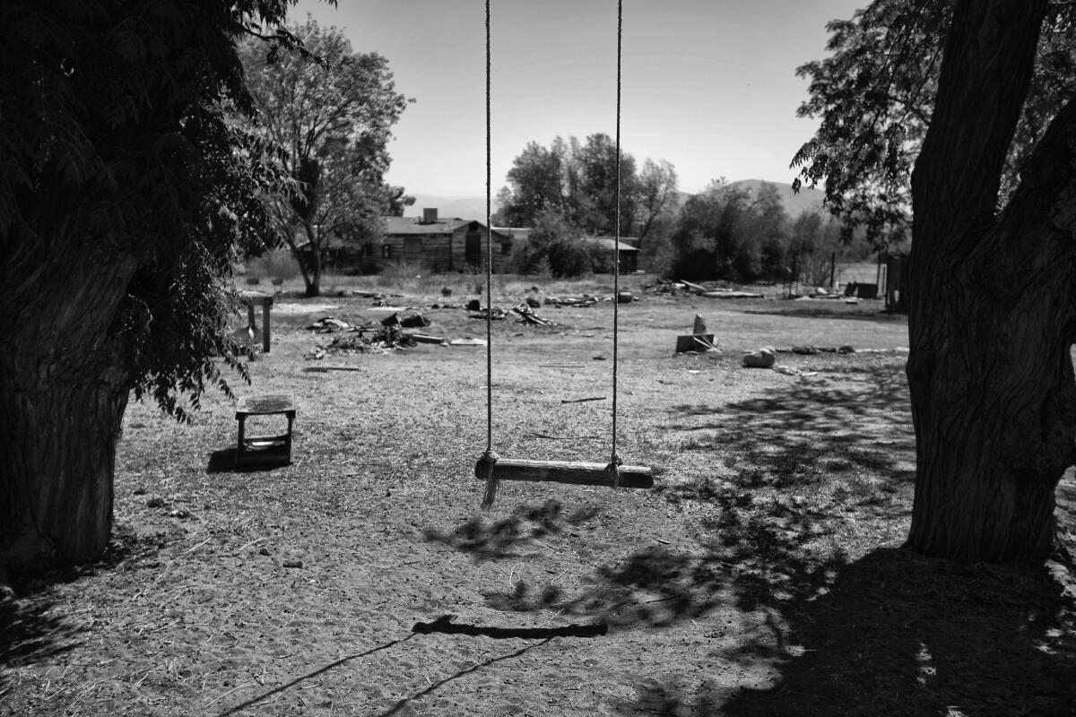 CALIFORNIA'S DUST BOWL: A swing sits empty in a dried out lot in East Porterville, Calif., where well after well is running dry.