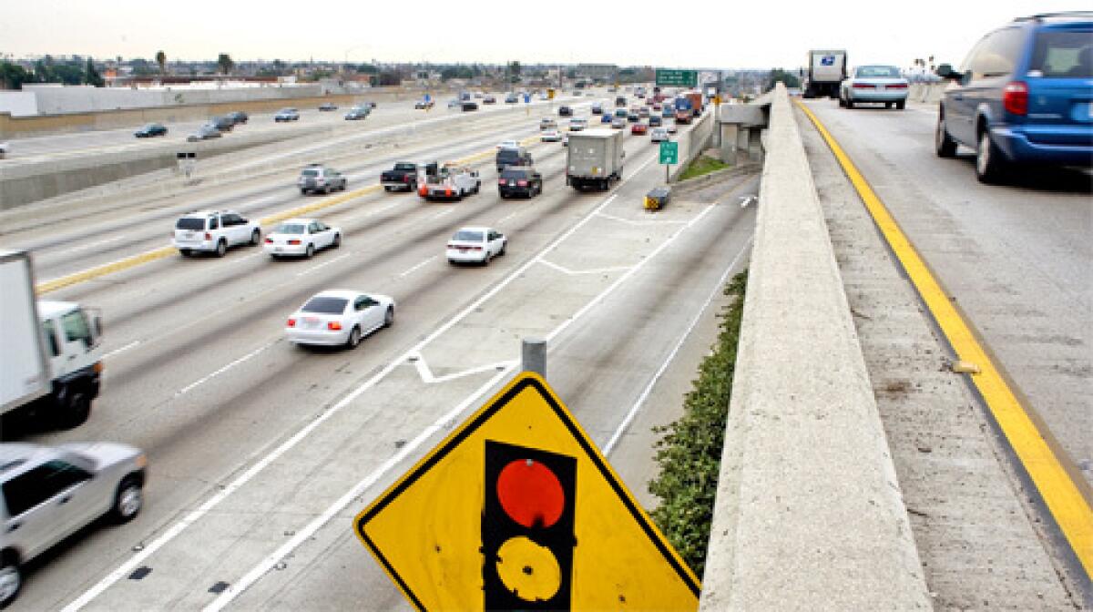 TRAFFIC: L.A. County transportation officials say that if they can win a huge U.S. grant, rush-hour toll lanes could become a reality on three local freeways, including the 110, above, by spring 2009.