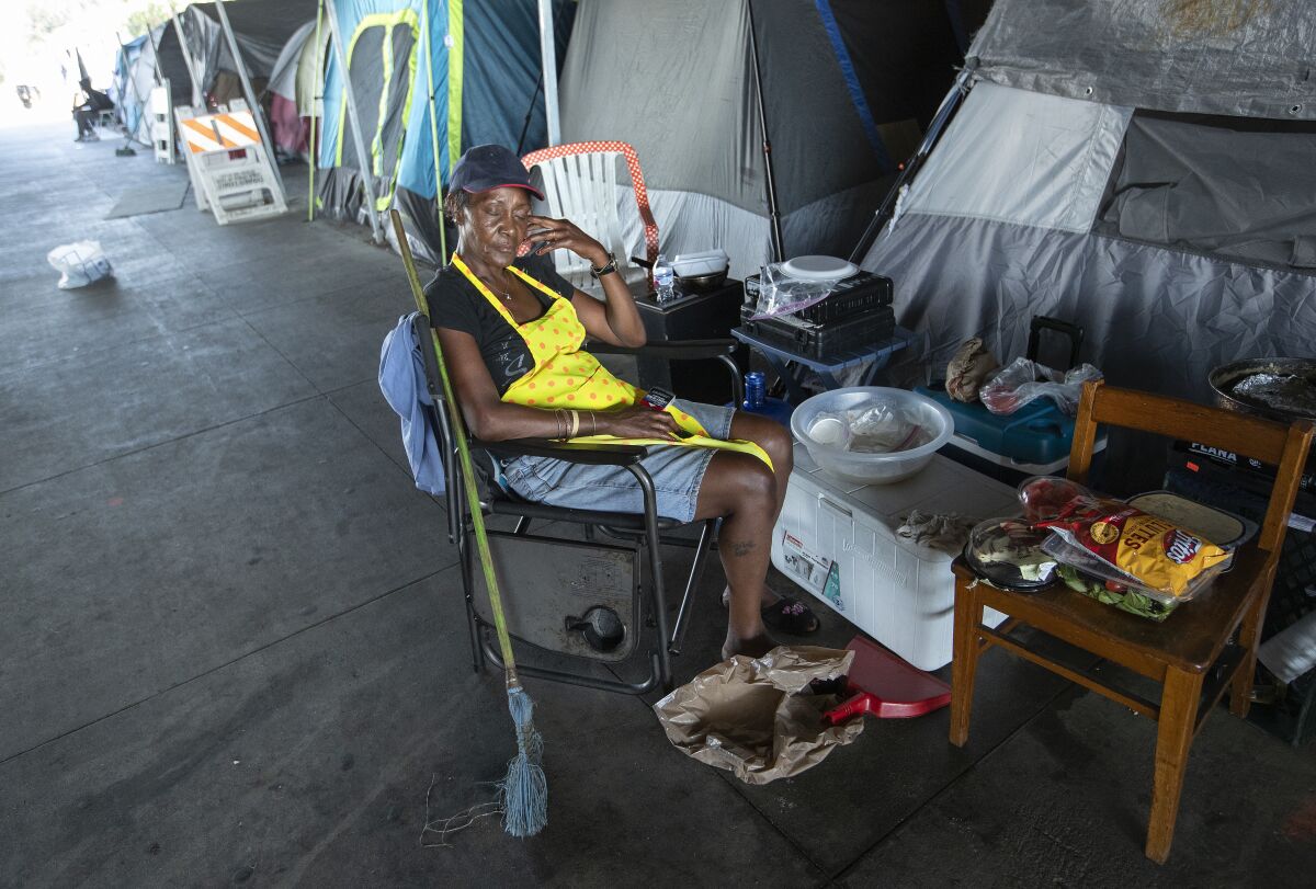 Catherine Hoskins, 58, gets some sleep at the homeless encampment in Pacoima.
