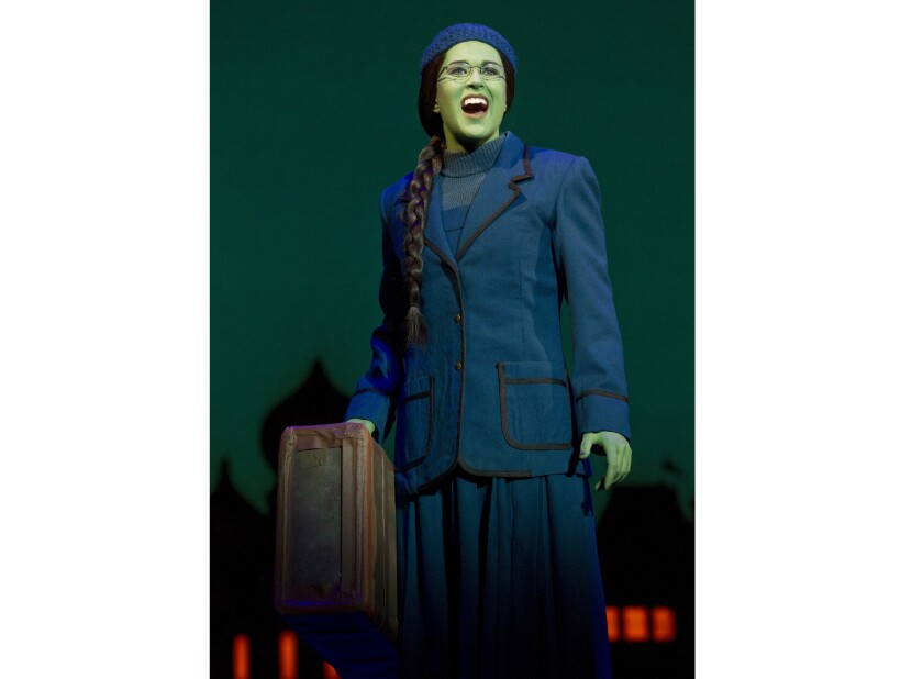 This image released by Polk & Co. shows understudy Carla Stickler in the role of Elphaba from the musical "Wicked" in New York in March 2012. Stickler, who had left show business and became a software engineer in Chicago, returned to New York to star as the green-skinned Elphaba when the cast was ravaged by illness. (Joan Marcus/Polk & Co. via AP)