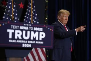 Former President Donald Trump greets supporters as he arrives at a commit to caucus rally, Tuesday, Dec. 19, 2023, in Waterloo, Iowa. (AP Photo/Charlie Neibergall)