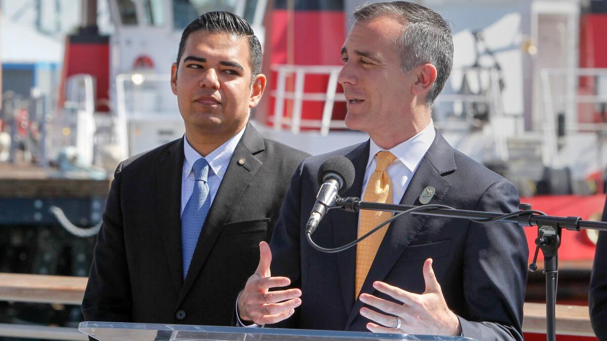 Los Angeles Mayor Eric Garcetti, right, and Long Beach Mayor Robert Garcia announce the signing of a joint declaration for clean air goals in the ports of Los Angeles and Long Beach.