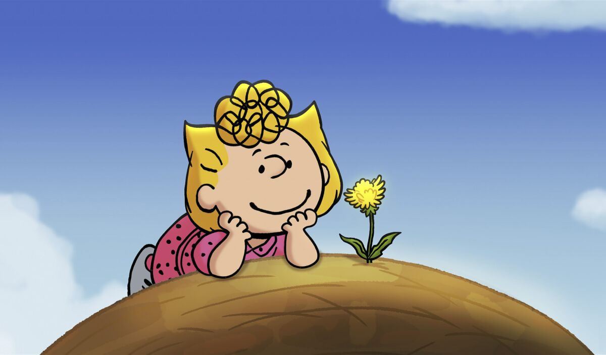 This image released by Peanuts Worldwide LLC shows Peanuts character Sally in a scene from the special “It’s the Small Things, Charlie Brown," debuting on Apple TV+ on Friday. In the 40-minute film, Charlie Brown’s hope to finally win the neighborhood championship baseball game is derailed when his little sister, Sally, choses to protect a dandelion growing on the pitcher’s mound. Soon everyone is cleaning up the ballfield. (Peanuts Worldwide LLC/Apple via AP)