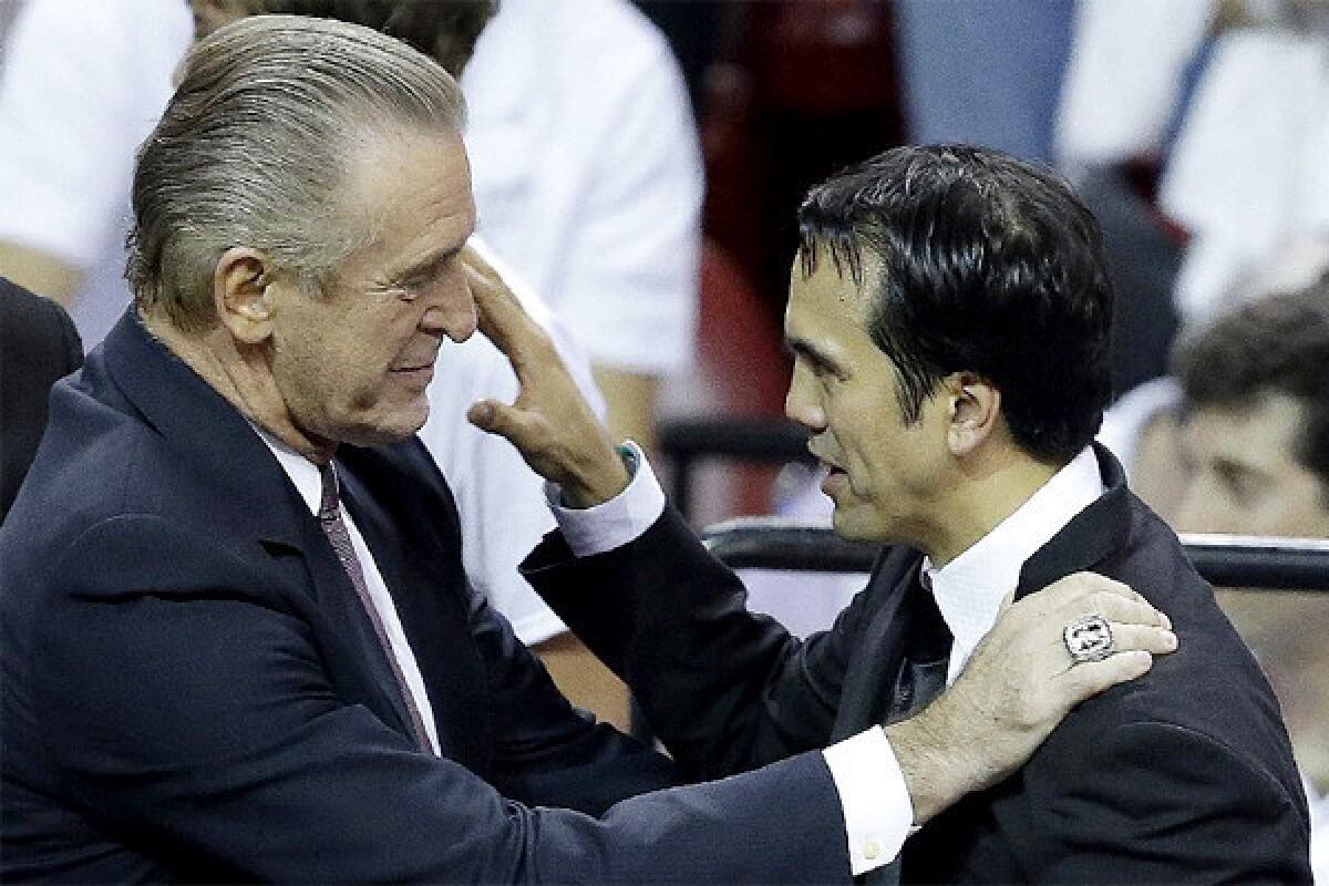 Miami Heat President Pat Riley, left, speaks to Coach Erik Spoelstra after Game 7 of the NBA Finals.