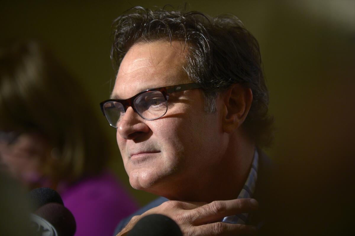 Dodgers Manager Don Mattingly takes part in a news conference Tuesday at baseball's winter meetings in Lake Buena Vista, Fla.
