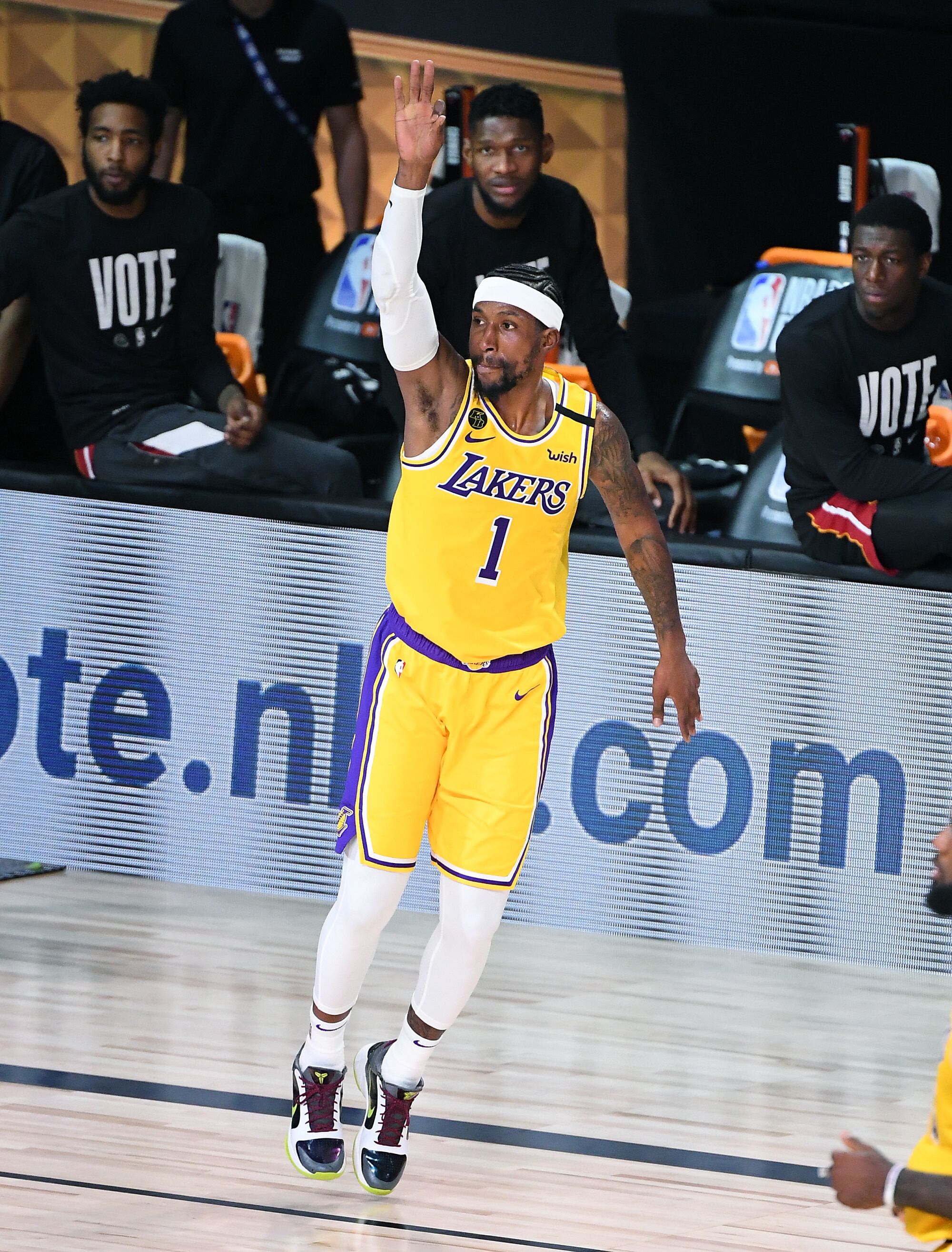 Lakers guard Kentavious Caldwell-Pope celebrates his three-pointer in front of the Heat bench during the fourth quarter.