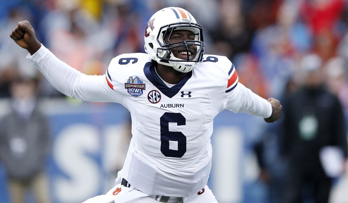 Auburn's Jeremy Johnson celebrates after passing for an 11-yard touchdown against Memphis in the third quarter of the Birmingham Bowl on Wednesday.