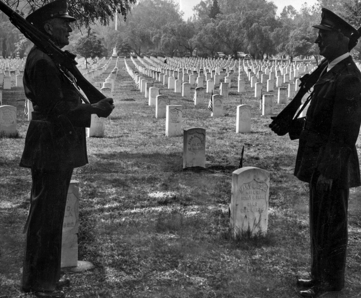 May 30, 1946: Veterans stand guard over graves of comrades at Sawtelle Veterans Cemetery during Memorial Day observance.