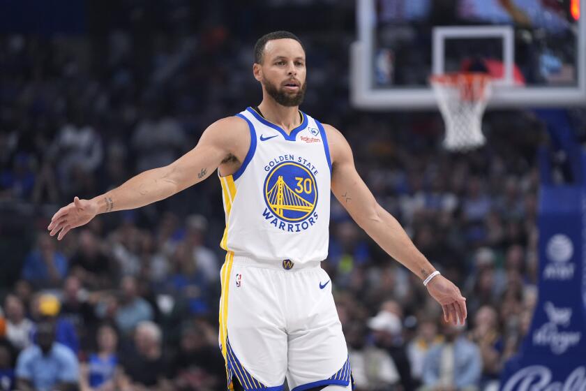 Golden State Warriors guard Stephen Curry reacts to a play during the first half of the team's NBA basketball game against the Dallas Mavericks in Dallas, Friday, April 5, 2024. (AP Photo/LM Otero)