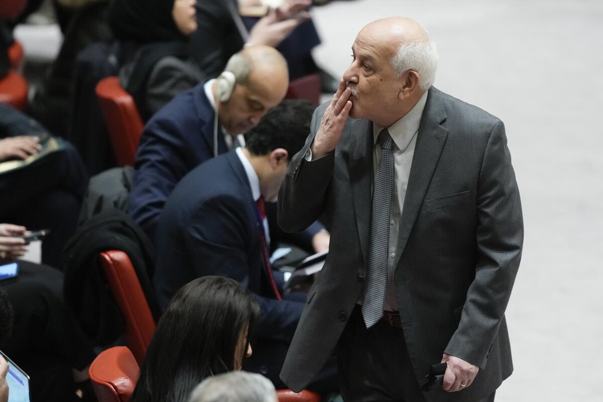 Riyad Mansour, Palestinian Ambassador to the United Nations, blows a kiss to someone at United Nations headquarters.