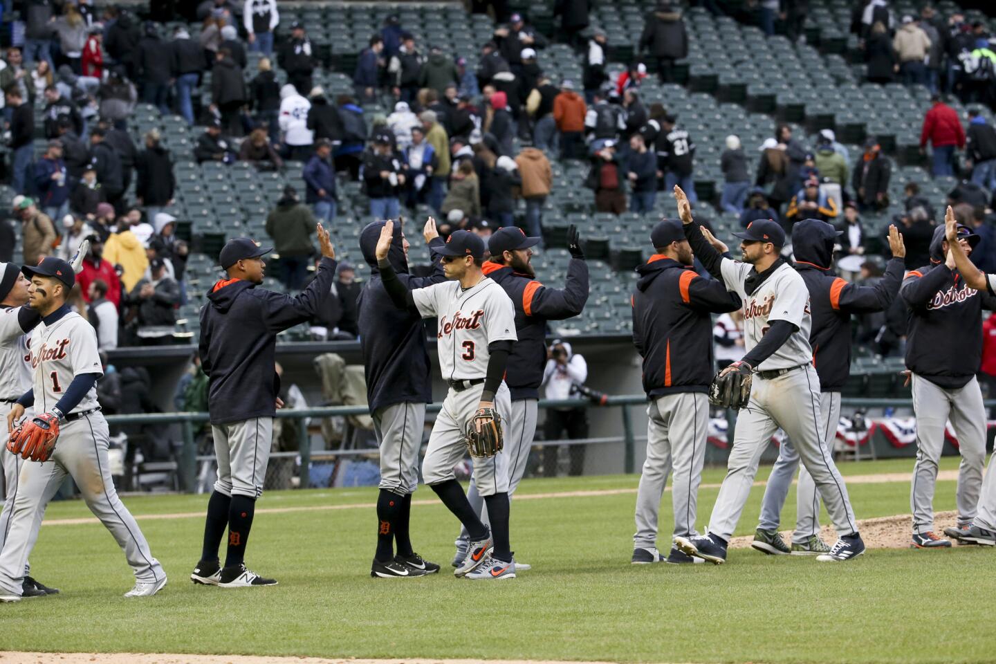 Detroit Tigers players celebrate after defeating the White Sox 6-3 on opening day at Guaranteed Rate Field.