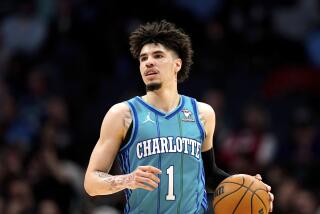 Charlotte Hornets guard LaMelo Ball (1) brings the ball up court against the Houston Rockets during the second half of an NBA basketball game Friday, Jan. 26, 2024 in Charlotte, N.C. (AP Photo/Jacob Kupferman)