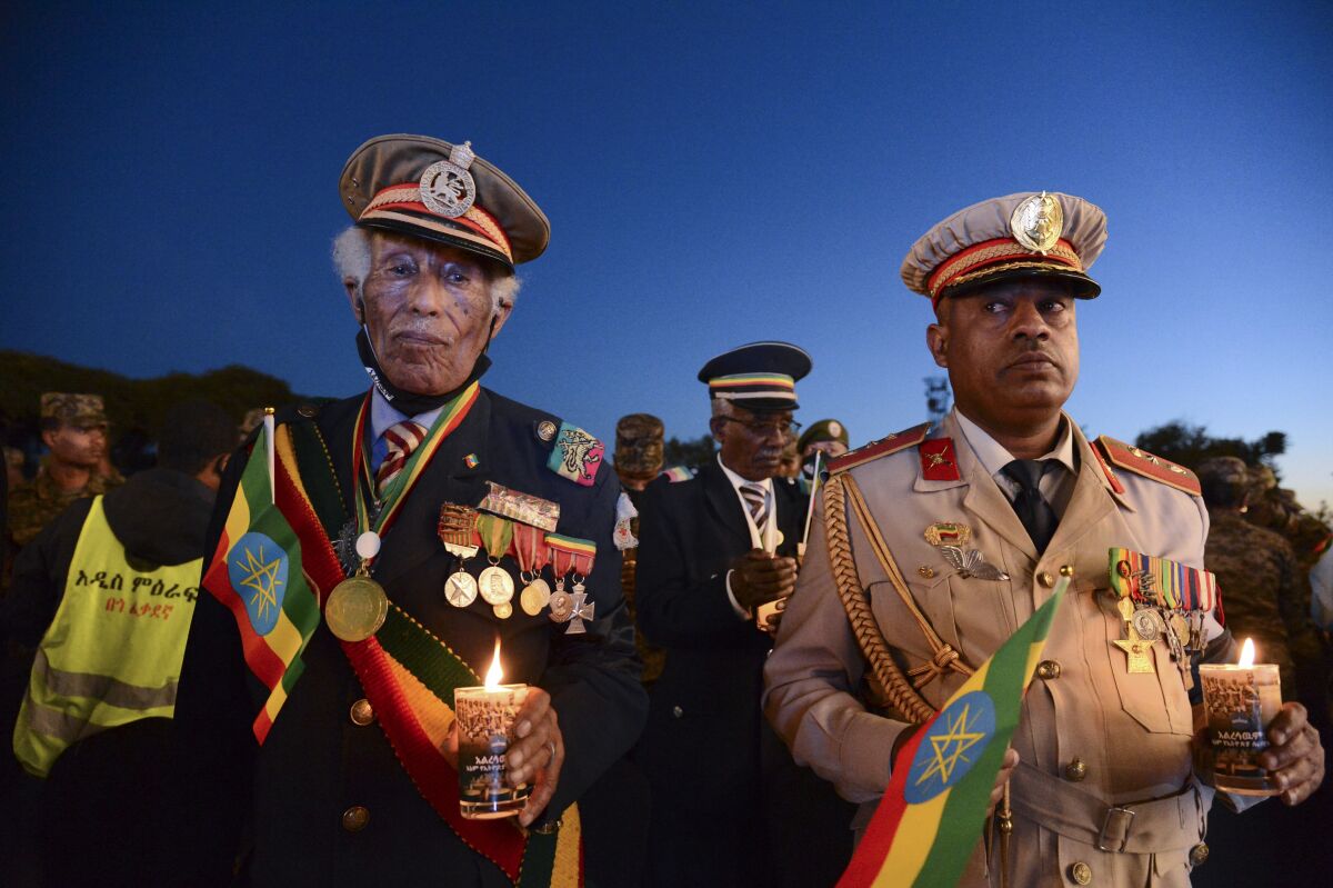 FILE - Current and former Ethiopian military personnel and the public commemorate federal soldiers killed by forces loyal to the Tigray People's Liberation Front (TPLF) at a candlelight event in Addis Ababa, Ethiopia, Wednesday, Nov. 3, 2021. The U.N. Security Council has called for an end to the intensifying and expanding conflict in Ethiopia, and for unhindered access for humanitarian aid to tackle the world's worst hunger crisis in a decade in the war-torn Tigray region. (AP Photo/File)