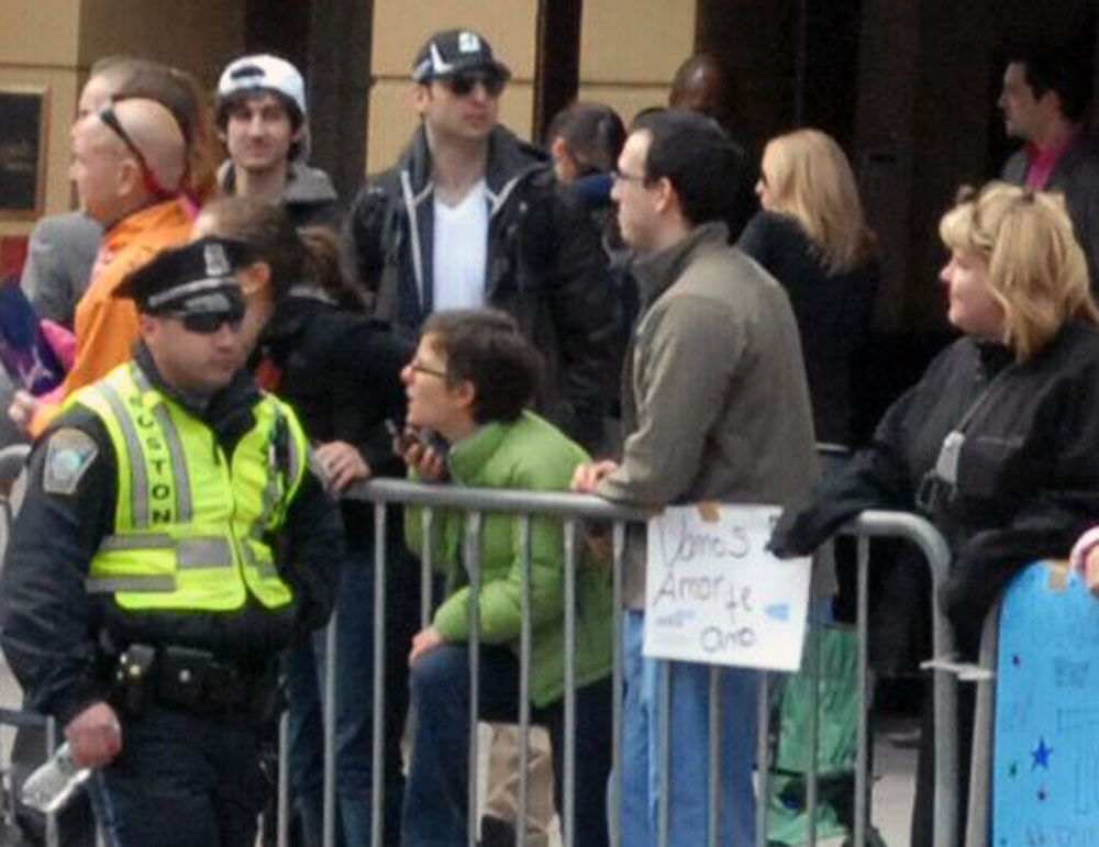 Dzhokhar and Tamerlan Tsarnaev, both wearing baseball caps, at the marathon 10 to 20 minutes before the bombings.