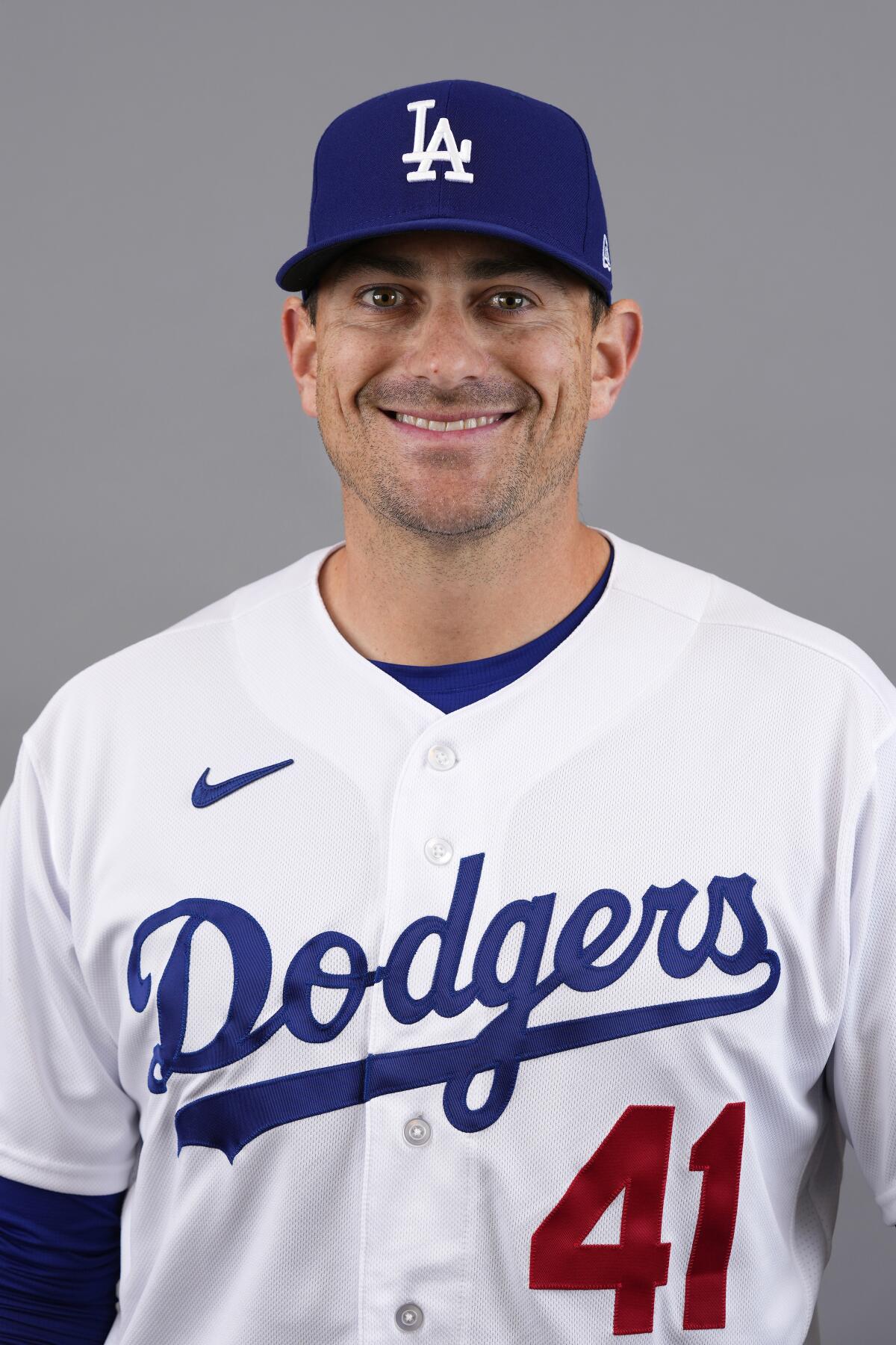 Relief pitcher Daniel Hudson poses for a portrait in his white Dodgers uniform