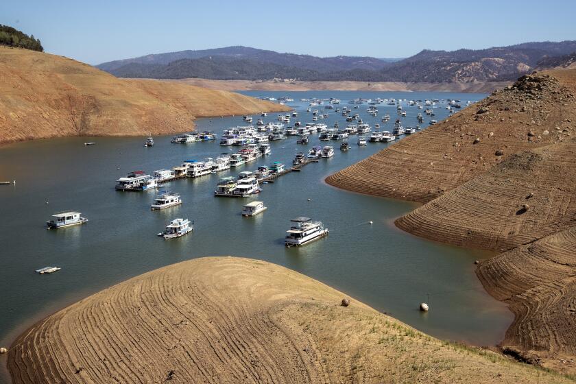 OROVILLE, CA - JUNE 29: Houseboats on the water at a receding Lake Oroville, which stands at 33 percent full and 40 percent of historical average when this photograph was taken on Tuesday, June 29, 2021 in Oroville, CA. (Brian van der Brug / Los Angeles Times)
