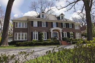This 14-room brick house in Winnetka, Ill., seen Friday, May 6, 2011, and featured in the 1990 movie "Home Alone" has been put up for sale for $2.4 million. The family comedy featured a young Macaulay Culkin defending the house from intruders. The 4,250-square foot house sits on a half-acre lot about 20 miles north of Chicago. There are four bedrooms and it features the staircase that Culkin sledded down in the movie. (AP Photo/ Nam Y. Huh)