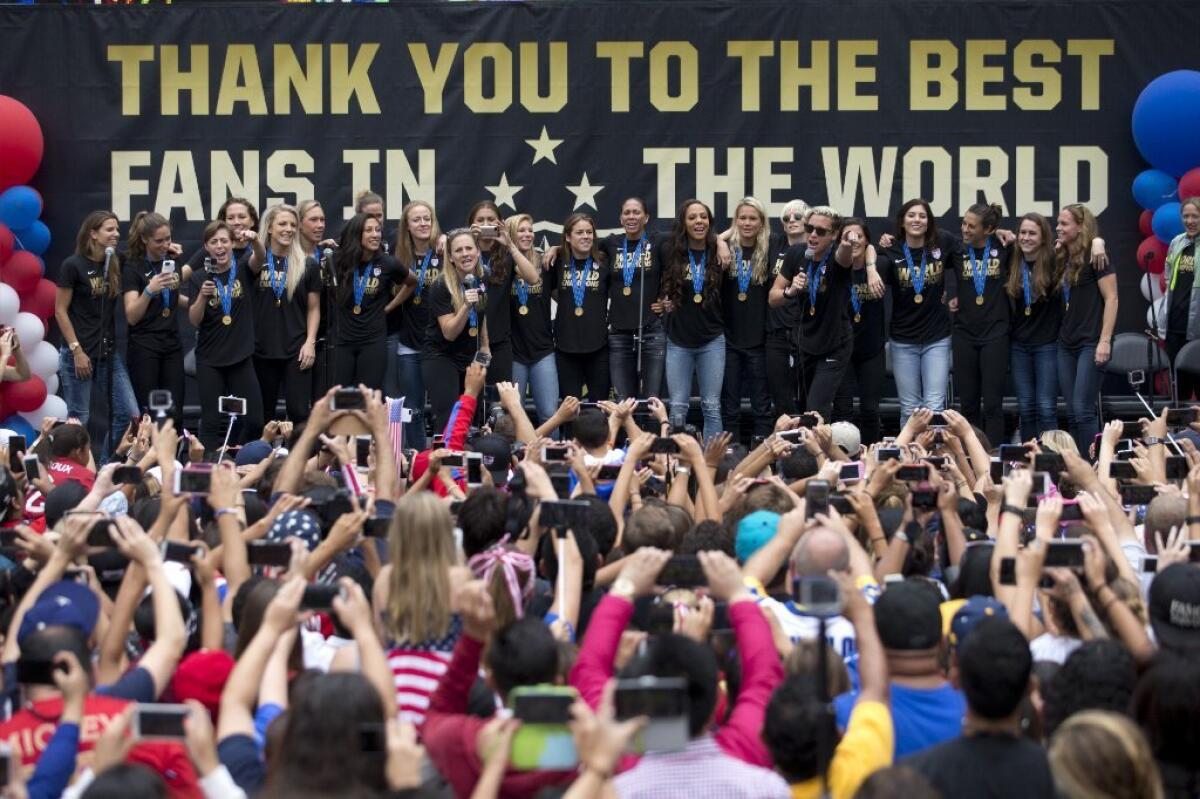 Fans cheer the U.S. women's national soccer team at a rally in Los Angeles on July 7. The team, which won the FIFA Women's World Cup, will get a ticker tape parade in New York City, the first such parade to honor a women's sports team.