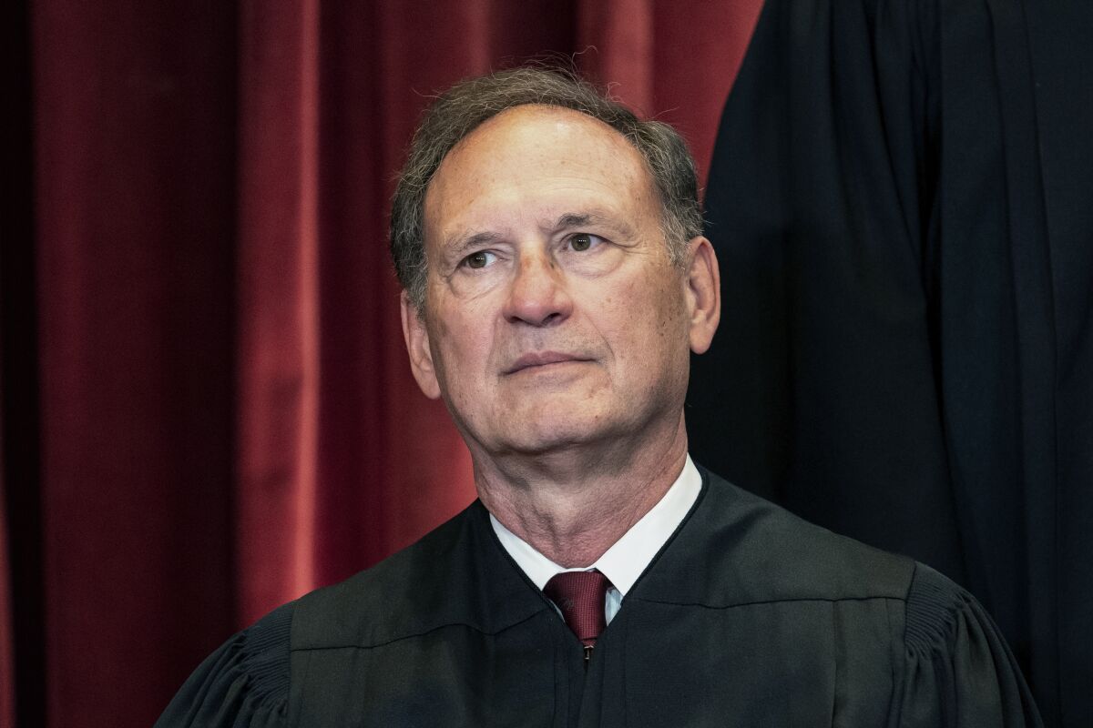 FILE - Associate Justice Samuel Alito sits during a group photo at the Supreme Court in Washington, Friday, April 23, 2021. The Supreme Court has ended constitutional protections for abortion that had been in place nearly 50 years, a decision by its conservative majority to overturn the court's landmark abortion cases. In the final opinion, Alito wrote that the court cannot allow our decisions to be affected by any extraneous influences such as concern about the publics reaction to our work. (Erin Schaff/The New York Times via AP, Pool)