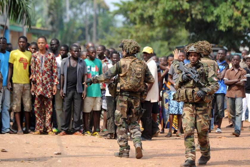 Troops conduct a disarmament operation Monday in Bangui, the capital of the Central African Republic.