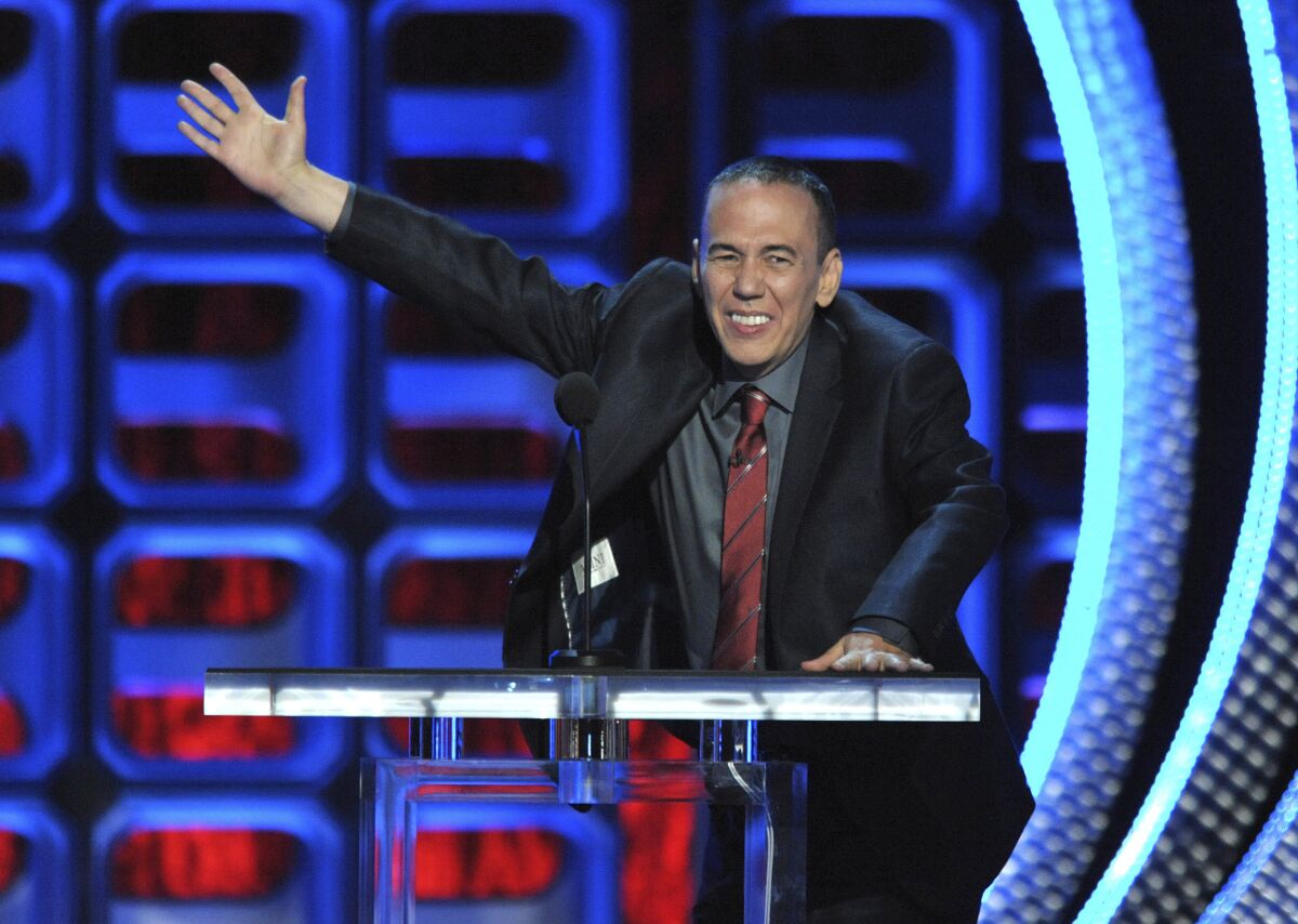 Gilbert Gottfried at a podium on stage