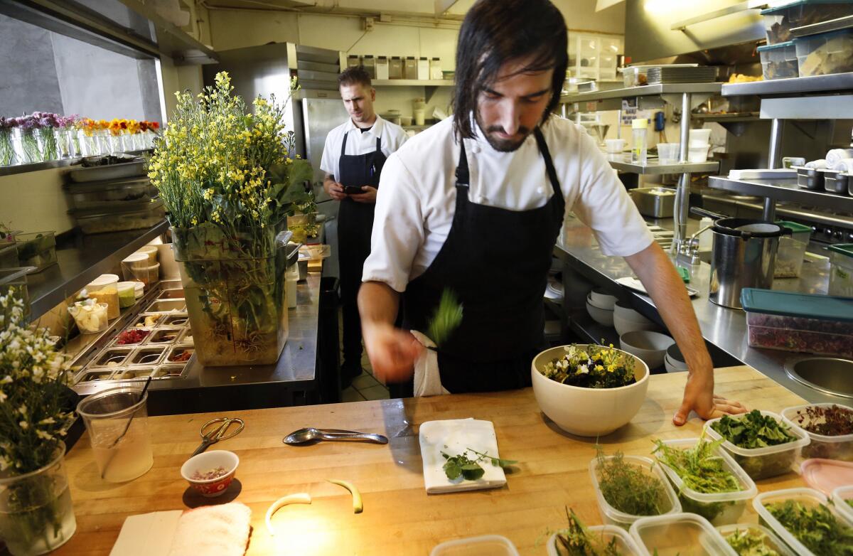 Chef Jordan Kahn prepares a dish inside the kitchen at Red Medicine restaurant in Beverly Hills earlier this year.