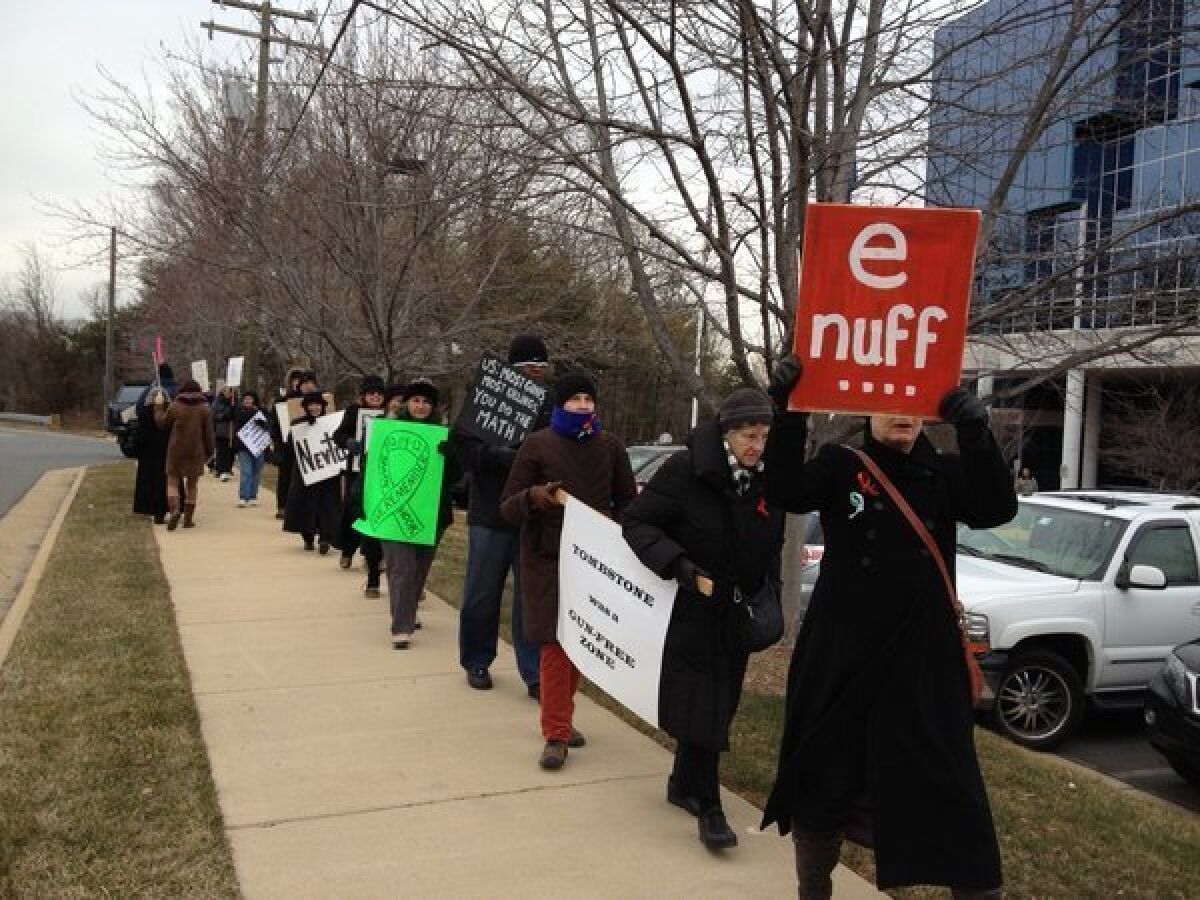 Protesters demonstrate outside of the NRA headquarters during a "Day of Action" to promote gun control proposals.