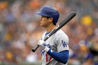 Los Angeles Dodgers' Shohei Ohtani waits on deck during the first inning of the team's baseball game against the Pittsburgh Pirates in Pittsburgh, Tuesday, June 4, 2024. (AP Photo/Gene J. Puskar)