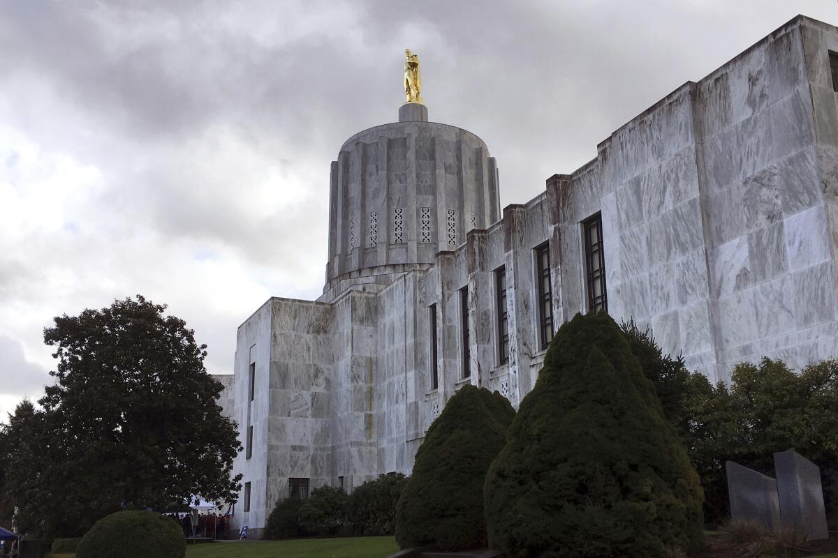 FILE - The Oregon state Capitol is seen in Salem, Ore., on Jan. 11, 2018. Oregon lawmakers will take up a full slate of legislation on pressing and polarizing issues from homelessness to gun control to abortion access when the legislative session starts next week after midterm elections that cost Democrats their supermajority but swept in a new, progressive governor. (AP Photo/Andrew Selsky, File)