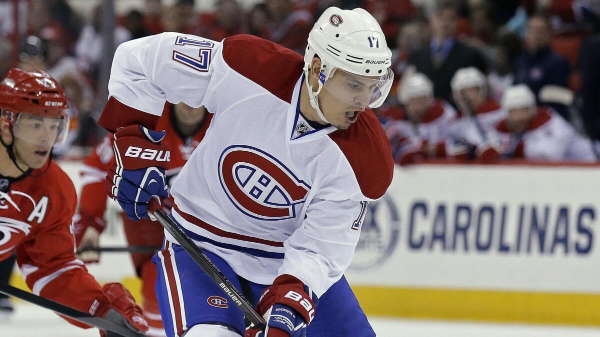 Montreal Canadiens forward Rene Bourque, who was traded to the Ducks on Thursday, controls the puck during a game against the Carolina Hurricanes in February. Bourque might make his Ducks debut Sunday against the Arizona Coyotes.