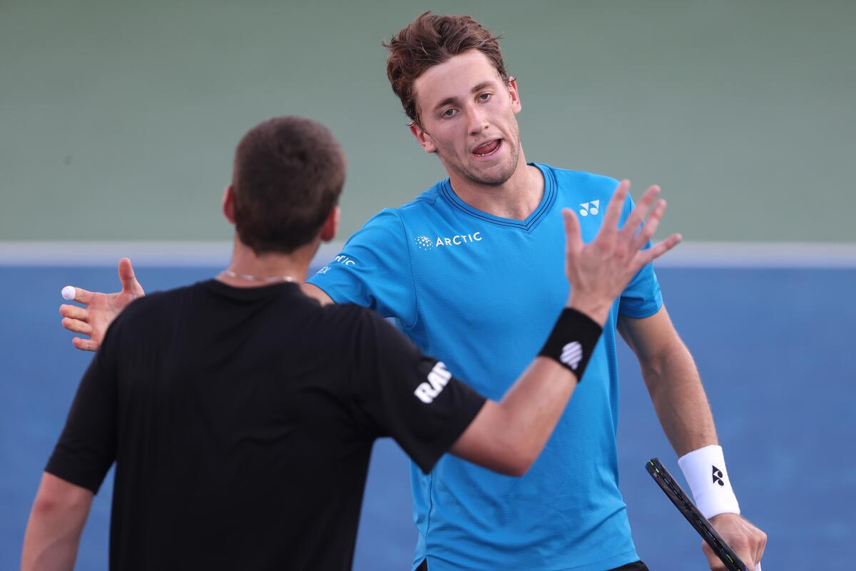 Casper Ruud shakes hands with Cameron Norrie after defeating him in the singles final of the San Diego Open on Oct. 3.