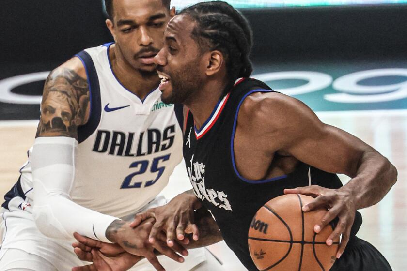 Los Angeles, CA, Tuesday, April 23, 2024 - LA Clippers forward Kawhi Leonard (2) dribbles past Dallas Mavericks forward P.J. Washington (25) during first Hal action in game two of the NBA Western Conference playoffs at Crypto.Com Arena. (Robert Gauthier/Los Angeles Times)