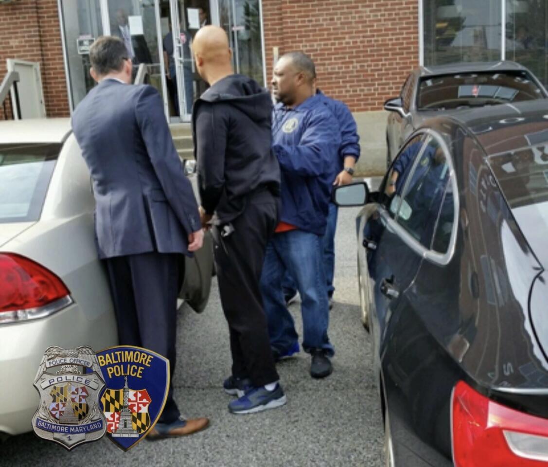 Baltimore police officers indicted Wednesday are taken into custody at the Baltimore Police Internal Affairs section.