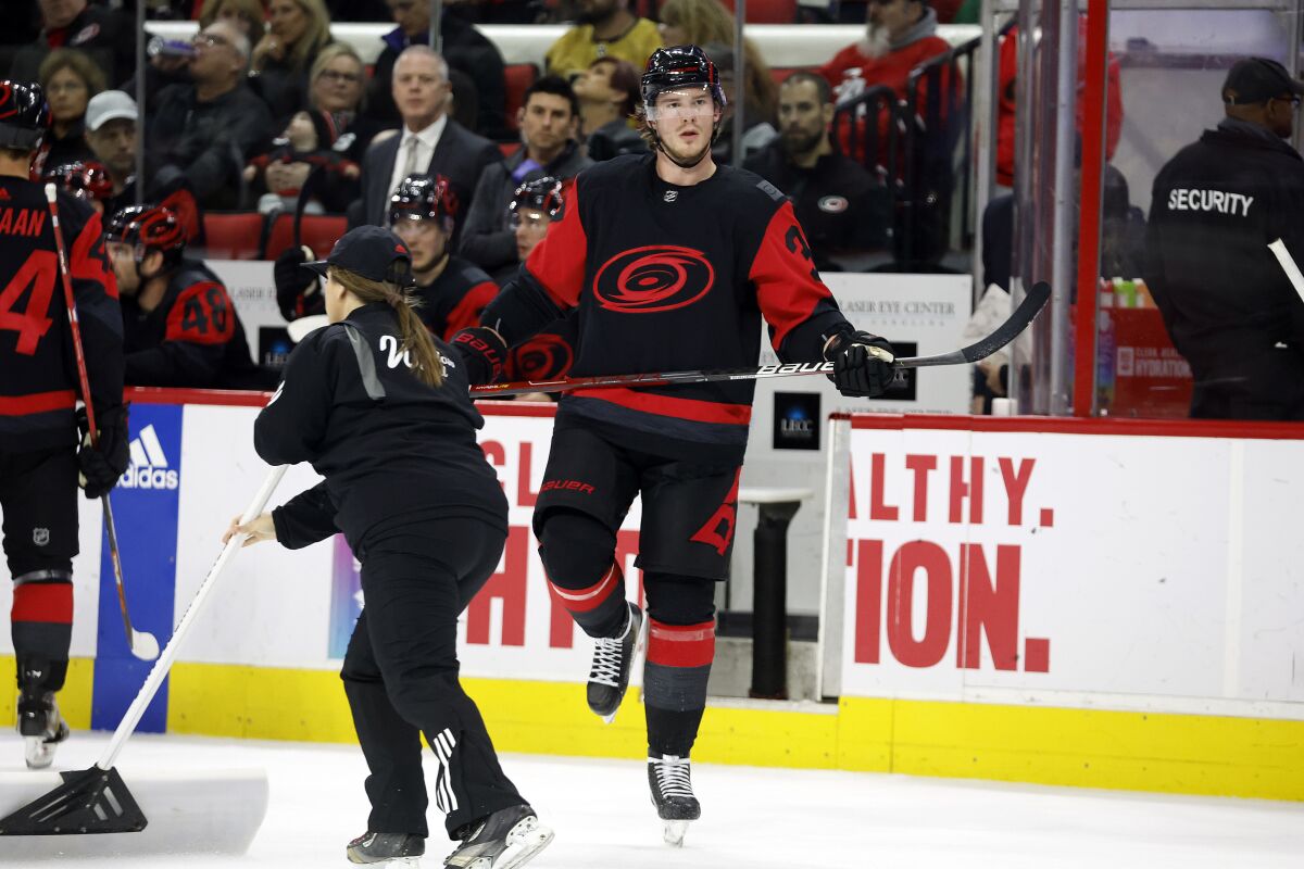 Carolina Hurricanes' Andrei Svechnikov (37) stretches his leg during a timeout in the second period of an NHL hockey game against the Vegas Golden Knights in Raleigh, N.C., Saturday, March 11, 2023. (AP Photo/Karl B DeBlaker)